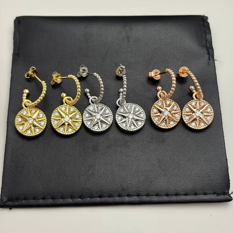 Brincos de Pino Bússola Estrela com Zircônia