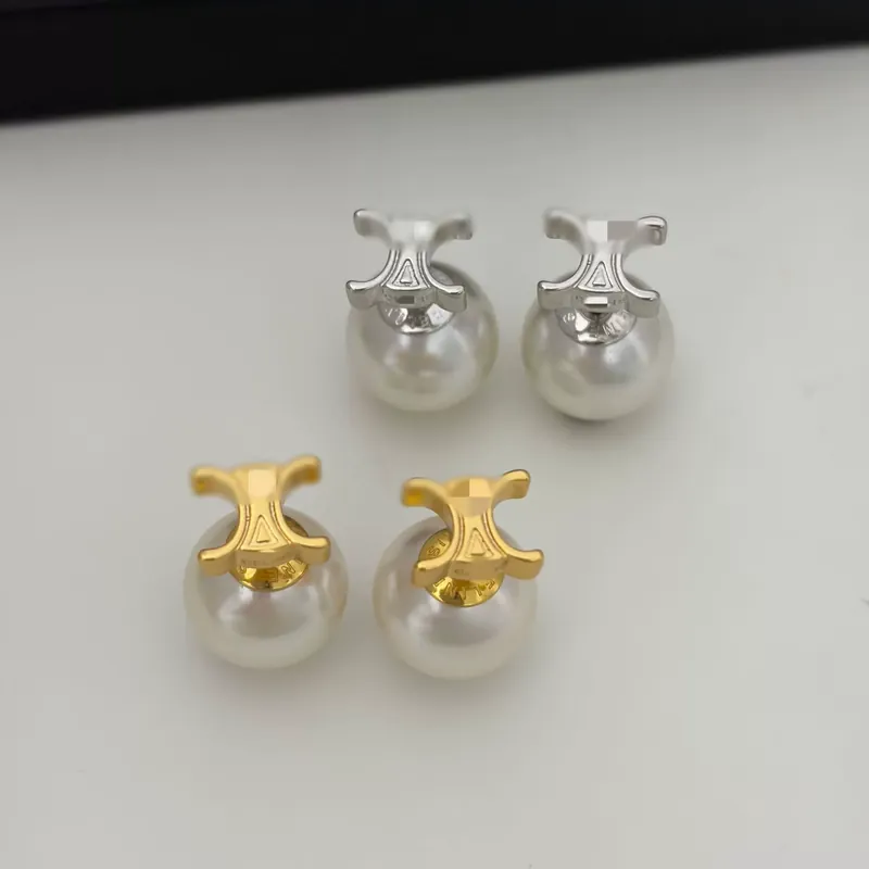 Boucles d'oreilles à puce perle Arc de Triomphe, texture métal élégante