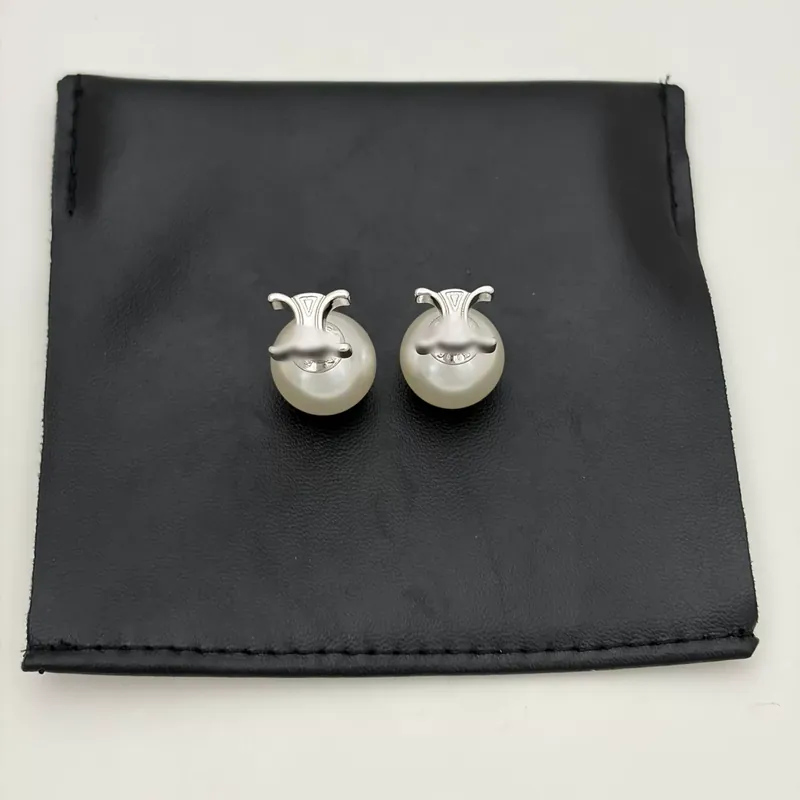 Boucles d'oreilles à puce perle Arc de Triomphe, texture métal élégante